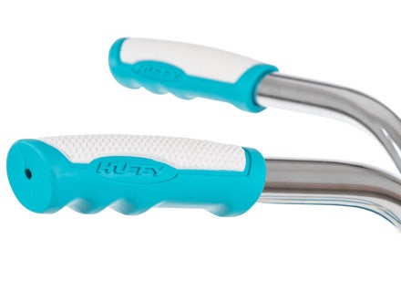 Close-up of teal and white ergonomic bike handlebar grips with Huffy branding, showcasing comfort and style.