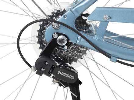 Close-up of Shimano 7-speed gear system on the Huffy Casoria Women’s Comfort Bike, showcasing precision engineering and durable construction. Close-up of Shimano 7-speed gear system on the Huffy Casoria Women’s Comfort Bike, showcasing precision engineering and durable construction.