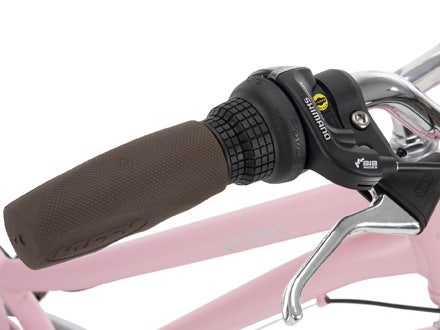 Close view of the Shimano grip shifter and ergonomic handlebar grip on a pink Huffy Sienna bike. Close view of the Shimano grip shifter and ergonomic handlebar grip on a pink Huffy Sienna bike.