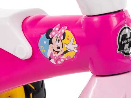 Close-up of Minnie Mouse graphics on a pink trike. Close-up of Minnie Mouse graphics on a pink trike.