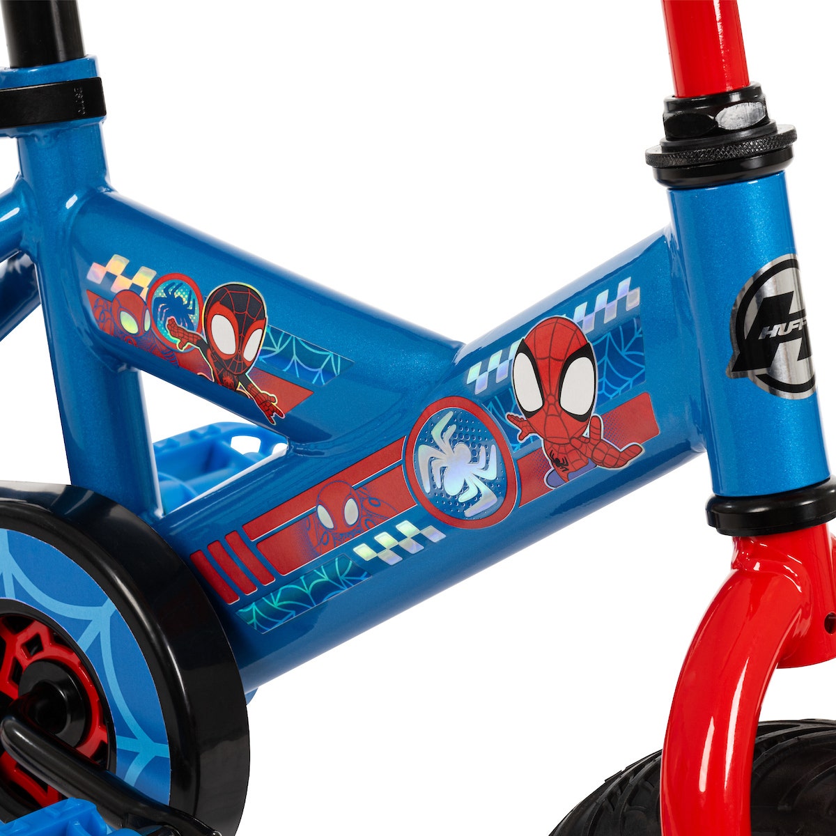 Close-up of a blue bike frame with Spidey and His Amazing Friends graphics featuring characters and web designs. Close-up of a blue bike frame with Spidey and His Amazing Friends graphics featuring characters and web designs.
