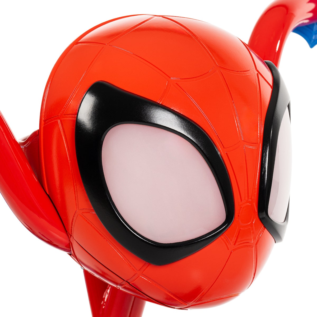 Close-up of a red 3D Spidey character head mounted on the front of the bike handlebars. Close-up of a red 3D Spidey character head mounted on the front of the bike handlebars.