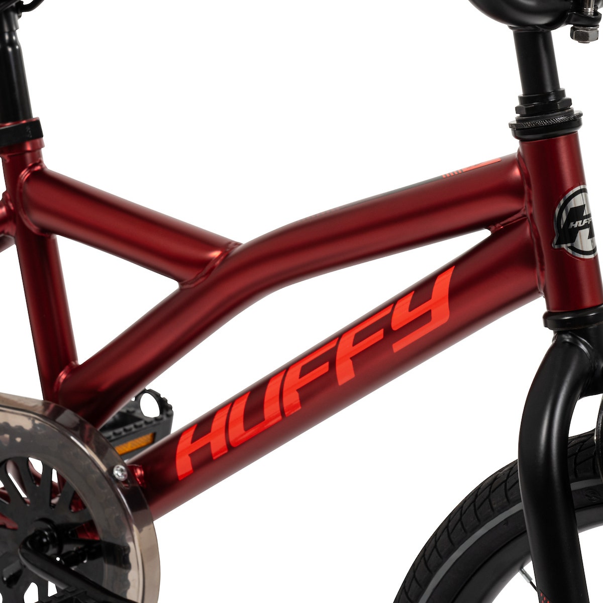 Side view of a red BMX bike frame with Huffy logo and modern design. Side view of a red BMX bike frame with Huffy logo and modern design.