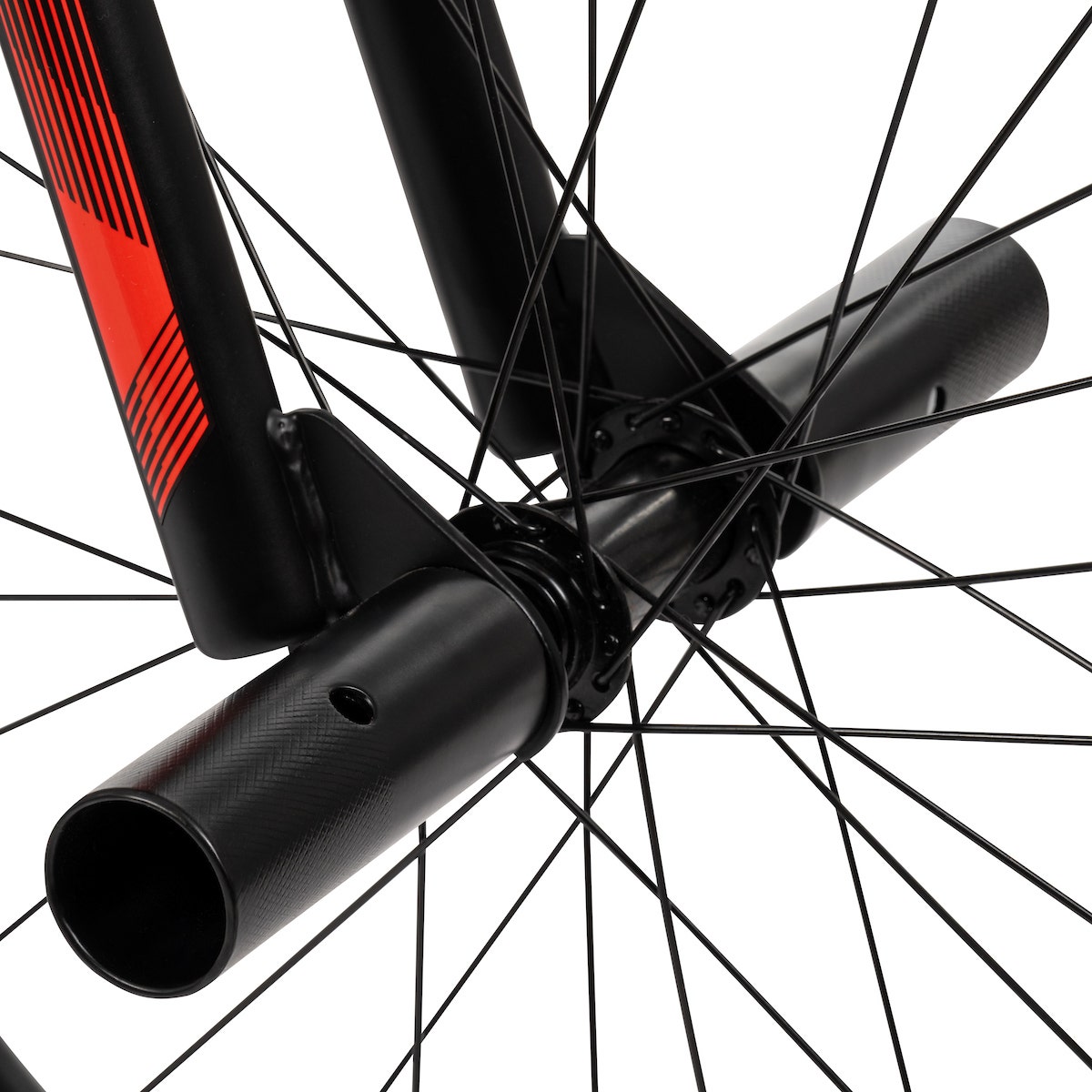 Close-up of front axle pegs on a BMX bike with black spokes and red fork accents. Close-up of front axle pegs on a BMX bike with black spokes and red fork accents.