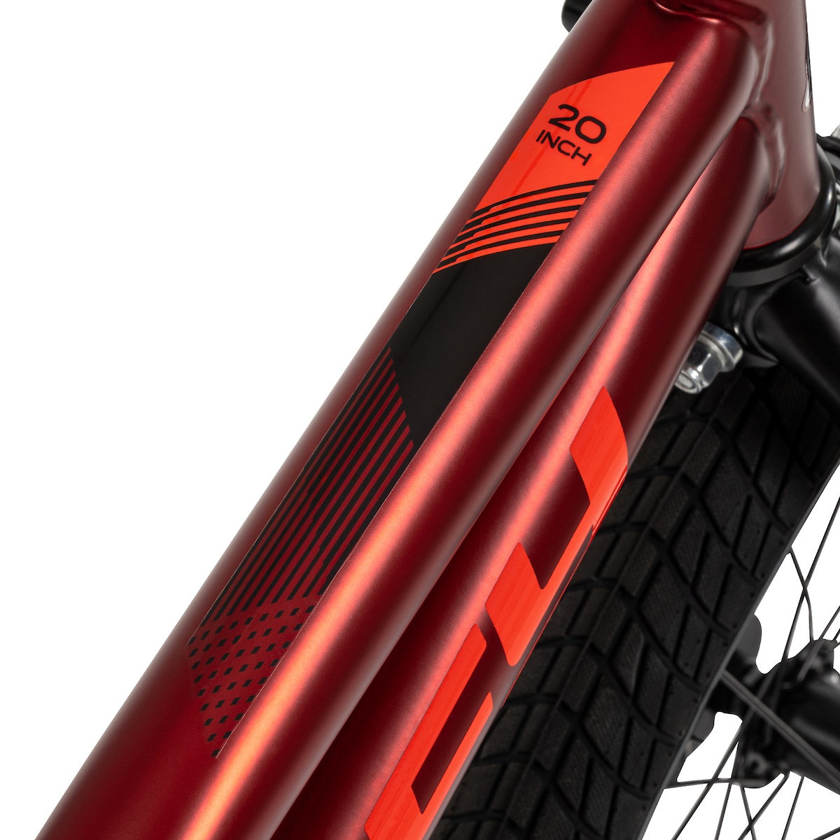 Close-up of a metallic red bike frame with black and orange geometric graphics and 20-inch sizing label. Close-up of a metallic red bike frame with black and orange geometric graphics and 20-inch sizing label.
