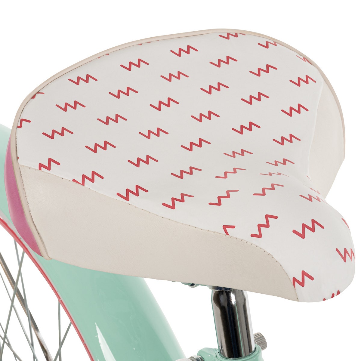 Close-up of a white and pink patterned cruiser bike saddle, featuring a wide, padded design for comfort and style. Close-up of a white and pink patterned cruiser bike saddle, featuring a wide, padded design for comfort and style.
